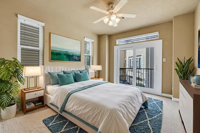 a bedroom with a large bed and a window