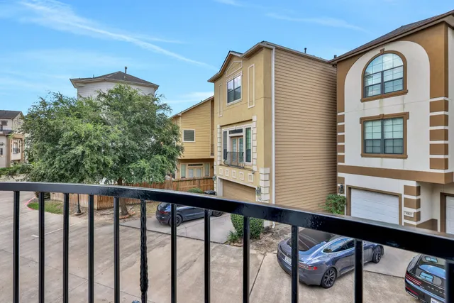 a view of a balcony with furniture and a window