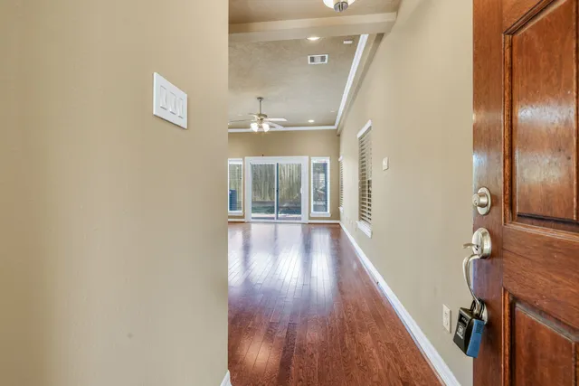 a view of gallery with wooden floor