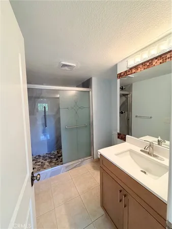 a white toilet sitting next to a white sink