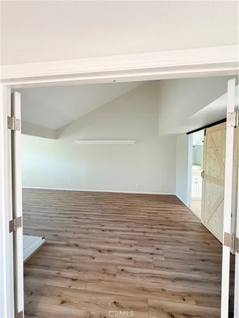 a view of room with a flat screen tv
