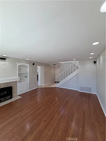 a kitchen with stainless steel appliances and white cabinets