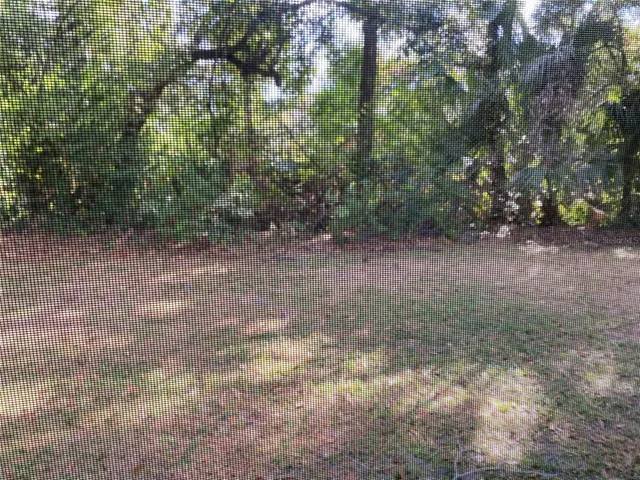 a en suite bathroom with a sink a window and a mirror