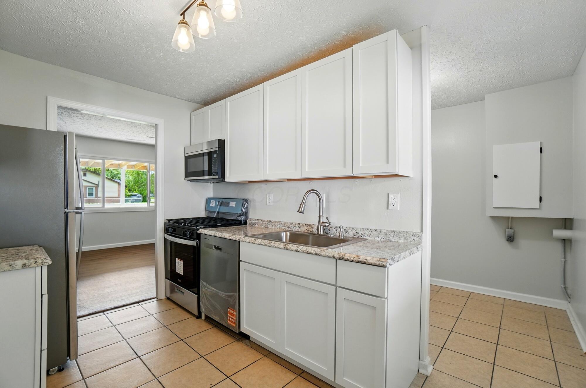 4561 St Rita Lane Columbus, OH 43213 - Photo 10 of 34 Kitchen to utility room