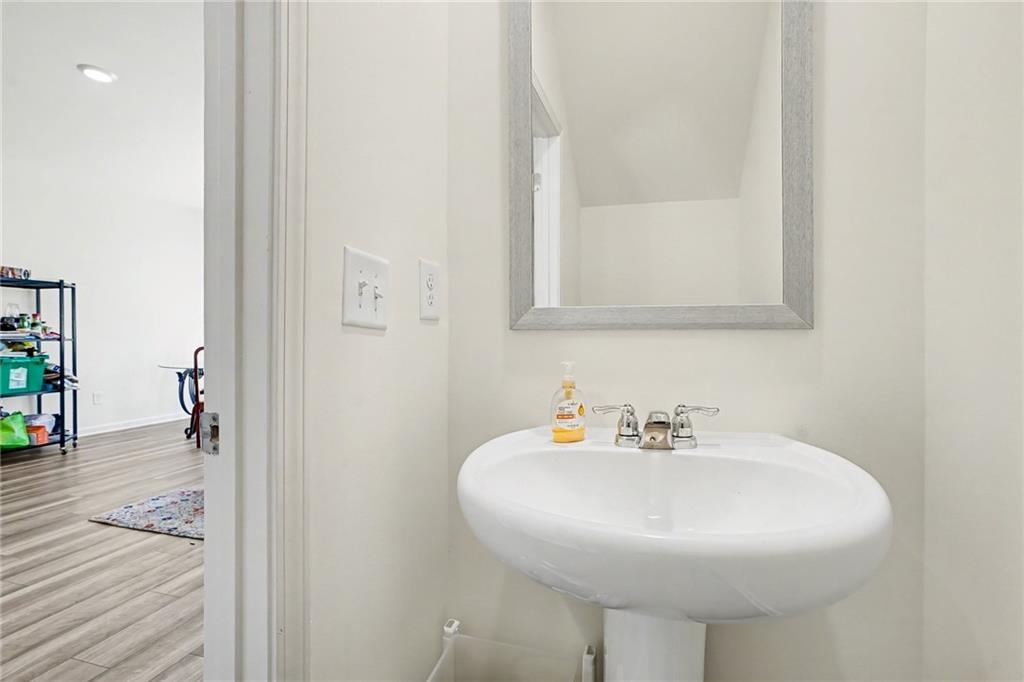 625 Jervis Way Locust Grove, GA 30248 - Photo 13 of 28 a bathroom with a sink and a mirror