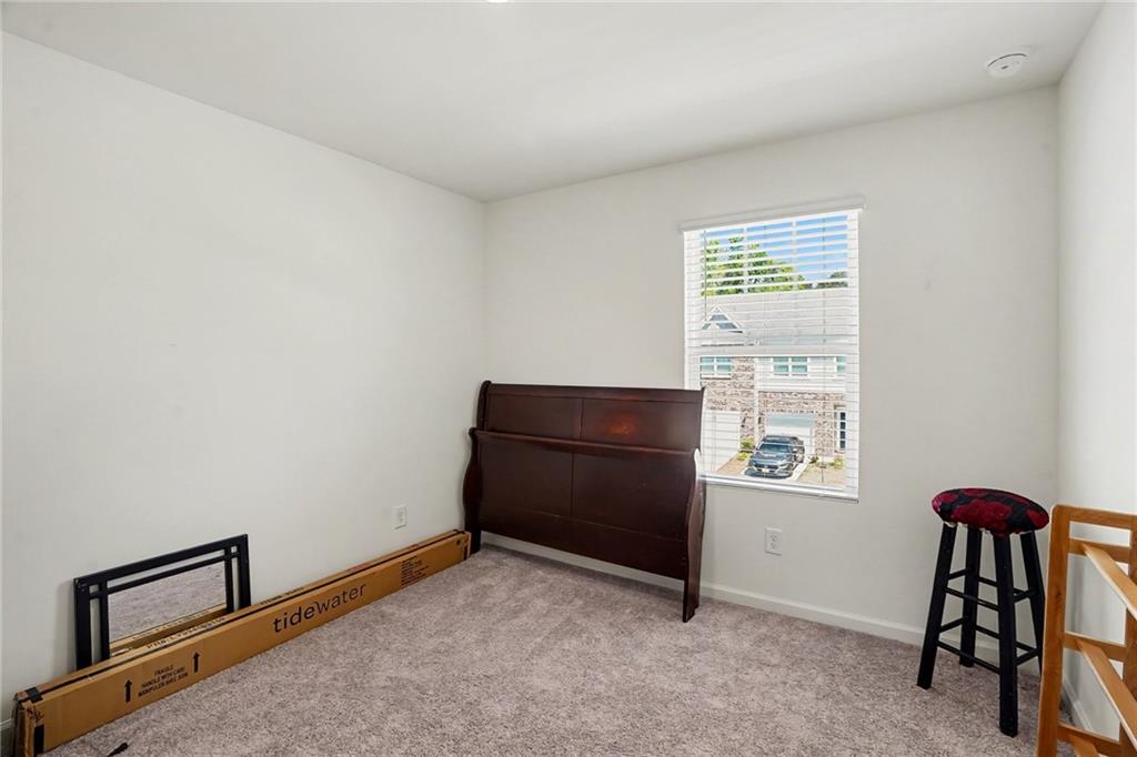 625 Jervis Way Locust Grove, GA 30248 - Photo 17 of 28 an empty room with windows and closet
