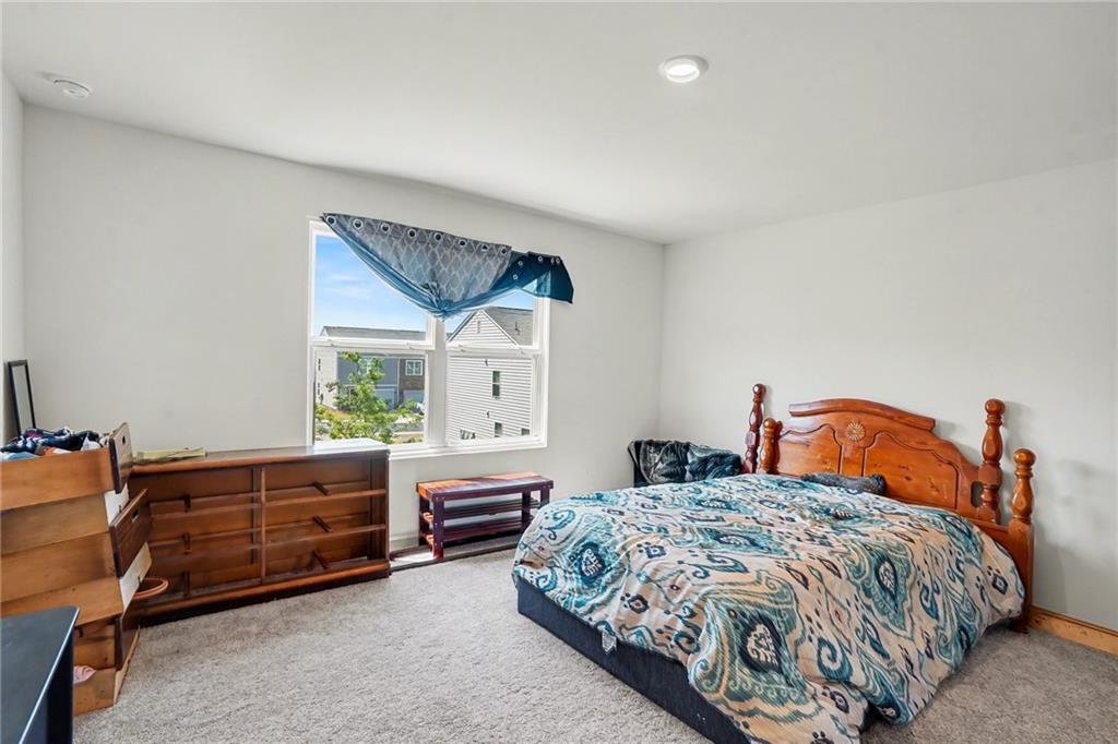 625 Jervis Way Locust Grove, GA 30248 - Photo 20 of 28 a bedroom with double bed and a window
