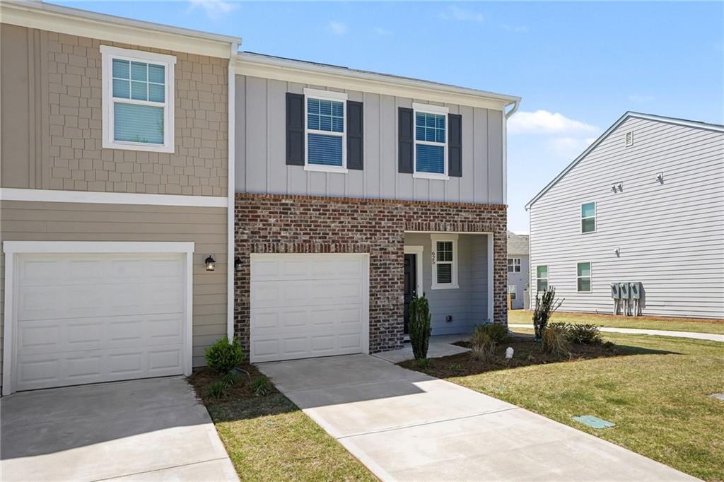 625 Jervis Way Locust Grove, GA 30248 - Photo 2 of 28 a front view of a house with a yard