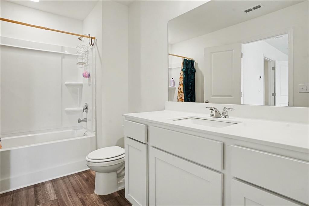 625 Jervis Way Locust Grove, GA 30248 - Photo 22 of 28 a bathroom with a sink toilet and shower