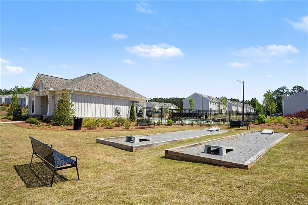 625 Jervis Way Locust Grove, GA 30248 - Photo 27 of 28 a swimming pool with outdoor seating and yard