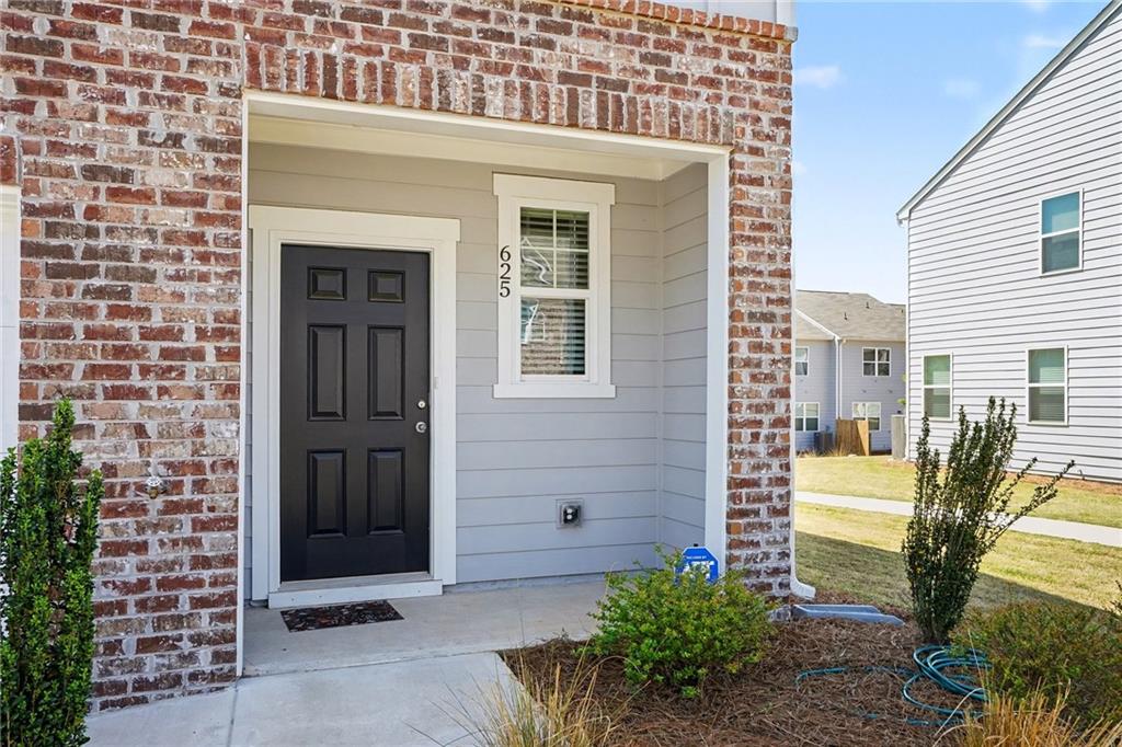 625 Jervis Way Locust Grove, GA 30248 - Photo 5 of 28 a view of a house with a door and wooden door