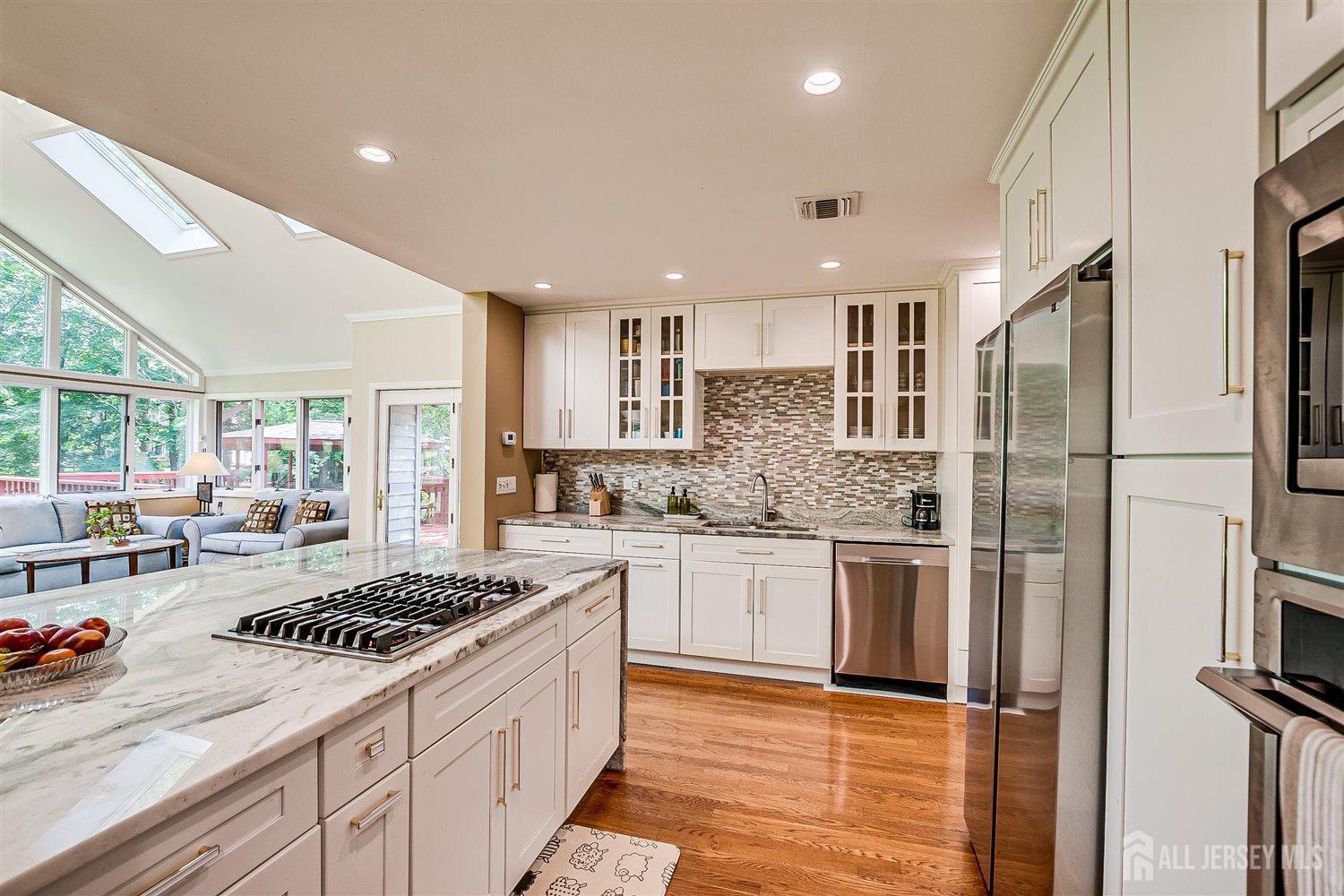 9 Fielding Place Edison, NJ 08820 - Photo 22 of 61 a kitchen with stainless steel appliances granite countertop a sink stove and refrigerator