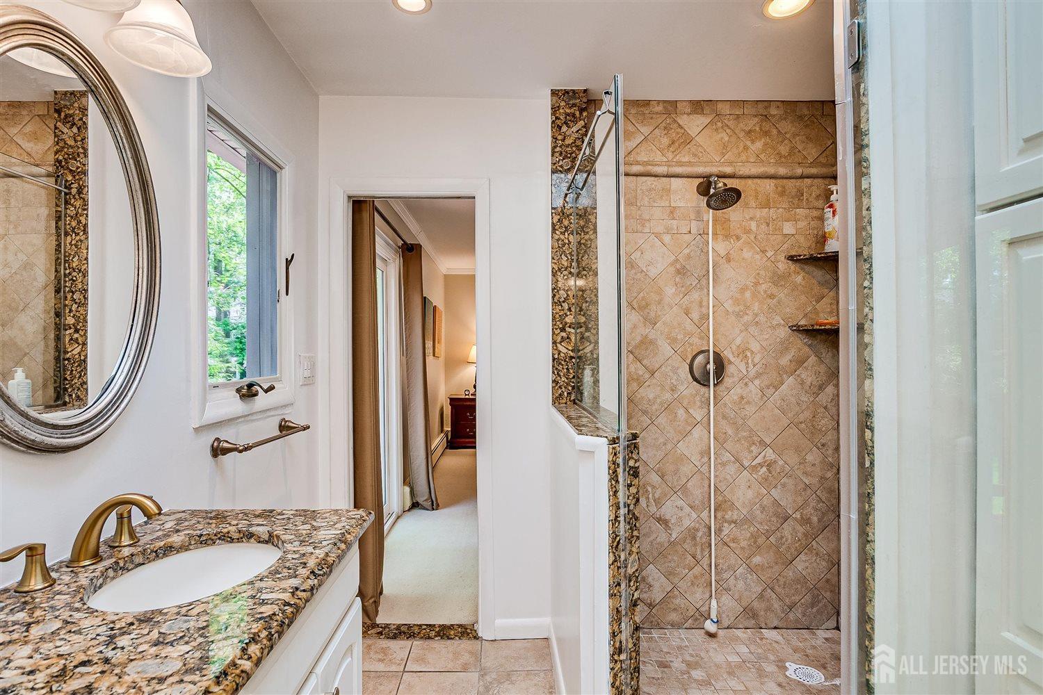 9 Fielding Place Edison, NJ 08820 - Photo 30 of 61 a bathroom with a granite countertop sink and a mirror