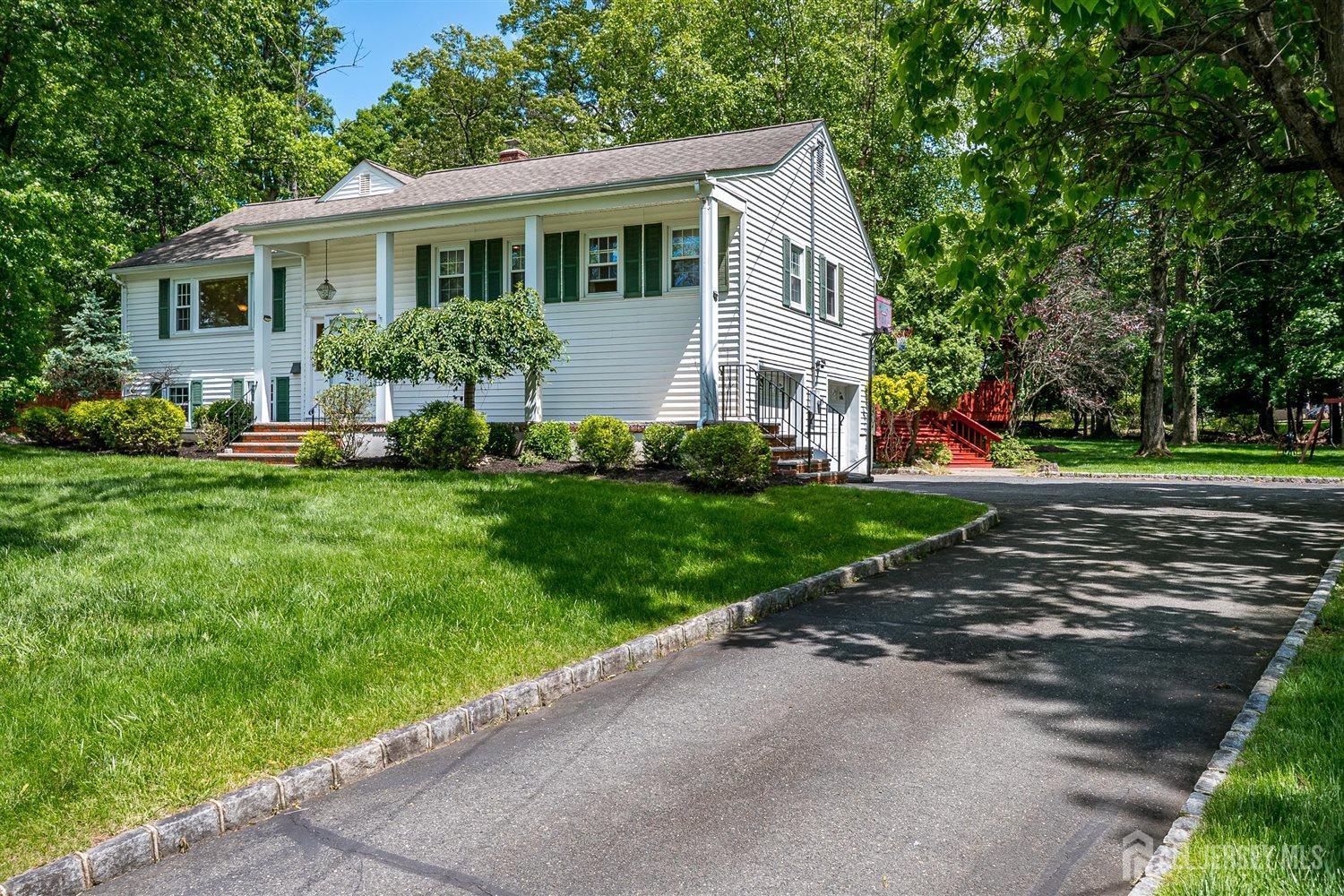 9 Fielding Place Edison, NJ 08820 - Photo 3 of 61 a front view of a house with a yard and trees