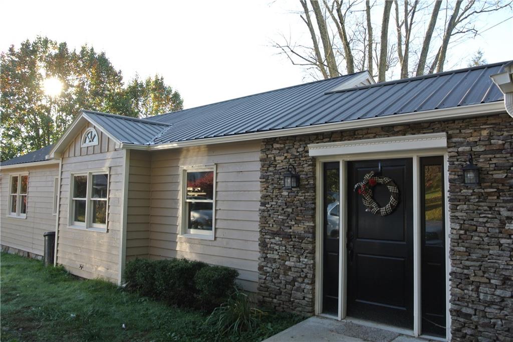 55 Patterson Street Blue Ridge, GA 30513 - Photo 1 of 1 All new exterior paint, new roof and new windows!