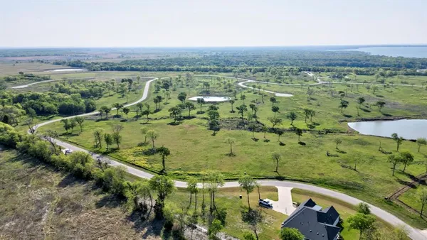 an aerial view of a houses with outdoor space