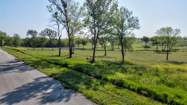 a view of a park with swings