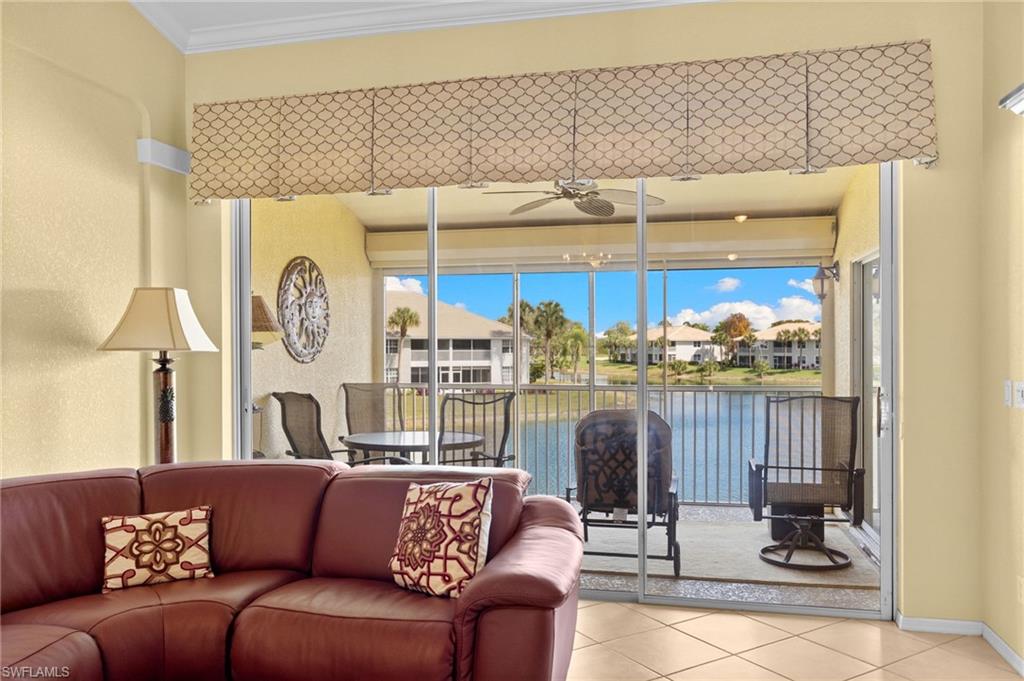 2255 Harmony Lane, Unit 204 Naples, FL 34109 - Photo 12 of 32 a living room with furniture