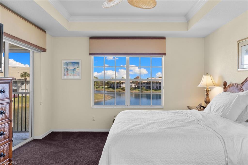 2255 Harmony Lane, Unit 204 Naples, FL 34109 - Photo 14 of 32 a bedroom with a bed and window