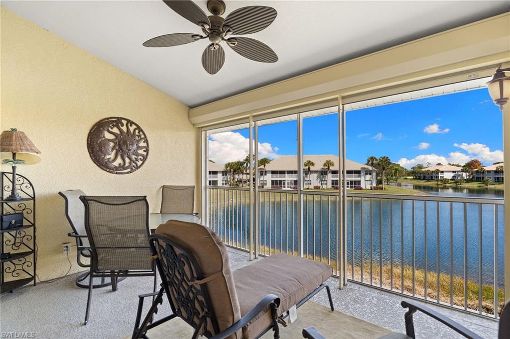 2255 Harmony Lane, Unit 204 Naples, FL 34109 - Photo 19 of 32 a view of a chairs and a table in a balcony