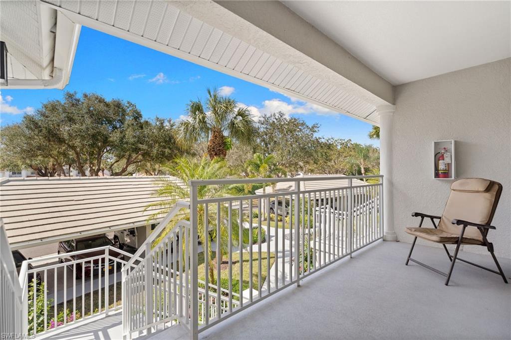 2255 Harmony Lane, Unit 204 Naples, FL 34109 - Photo 24 of 32 a view of a balcony with chairs
