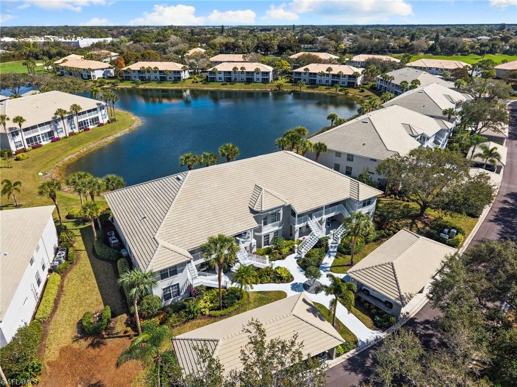 2255 Harmony Lane, Unit 204 Naples, FL 34109 - Photo 25 of 32 an aerial view of a house with outdoor space