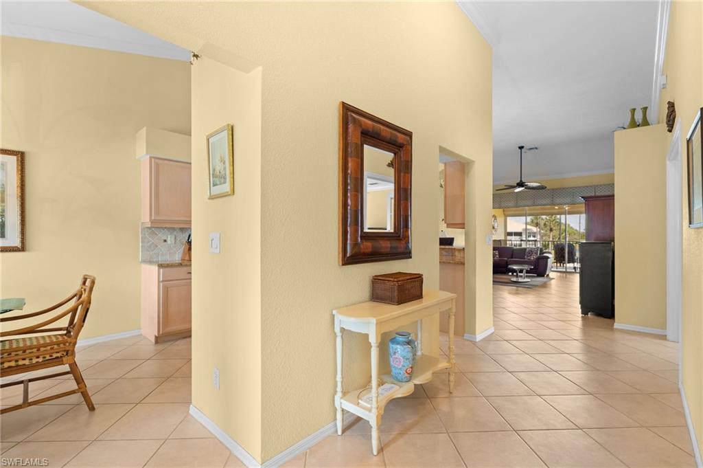 2255 Harmony Lane, Unit 204 Naples, FL 34109 - Photo 3 of 32 a view of a livingroom with furniture and kitchen view