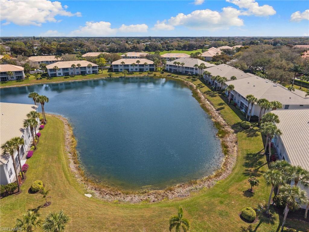2255 Harmony Lane, Unit 204 Naples, FL 34109 - Photo 30 of 32 an aerial view of residential houses with outdoor space