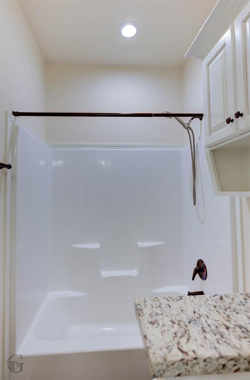 922 Antler Drive Haughton, LA 71037 - Photo 19 of 24 Tub and shower combination with oil-rubbed bronze fixtures