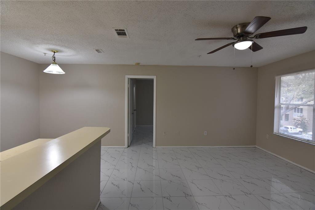 956 Salt Pond Place, Unit 303 Altamonte Springs, FL 32714 - Photo 7 of 17 a view of an empty room with a window