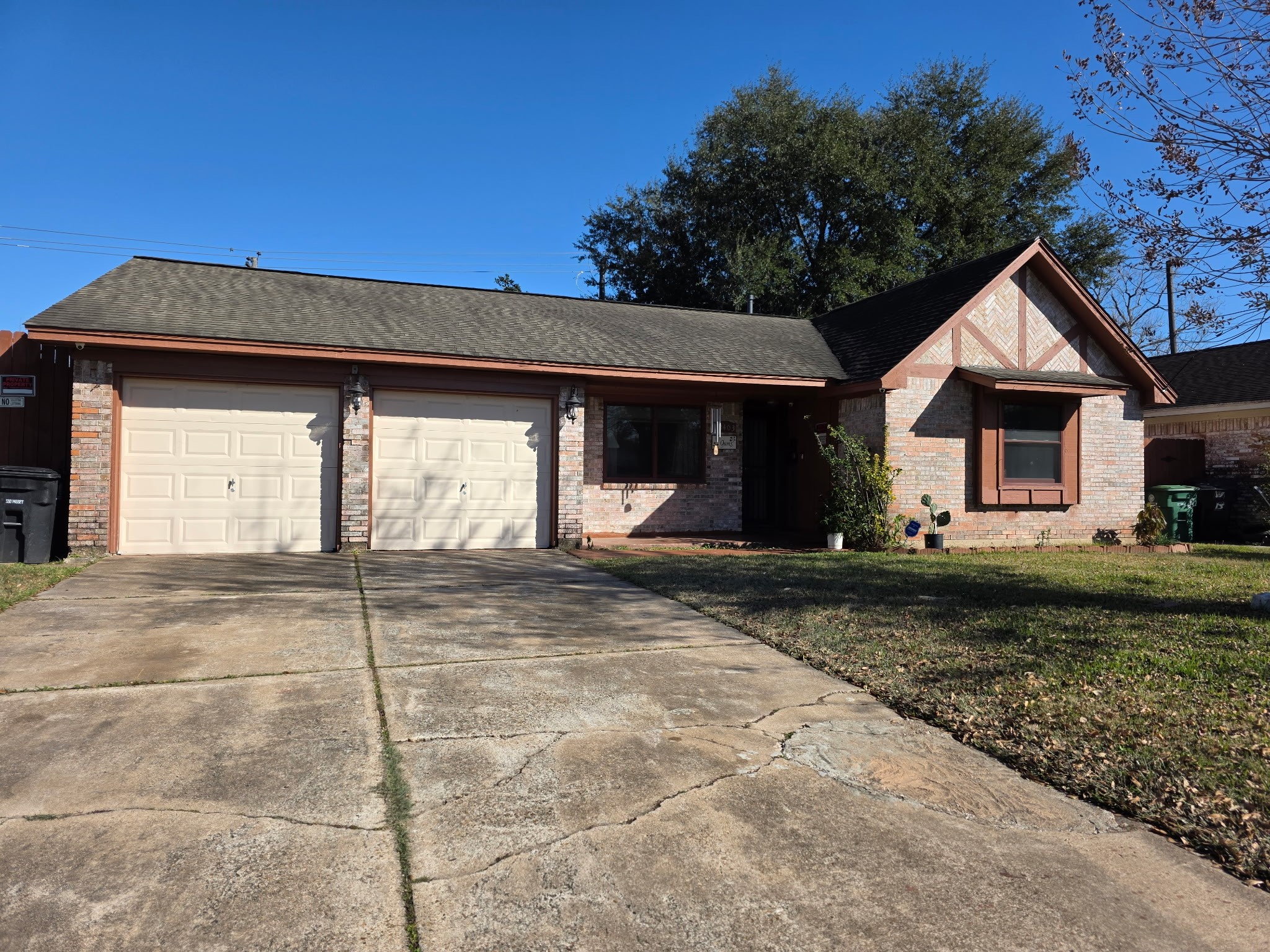 a view of a house with a yard and garage