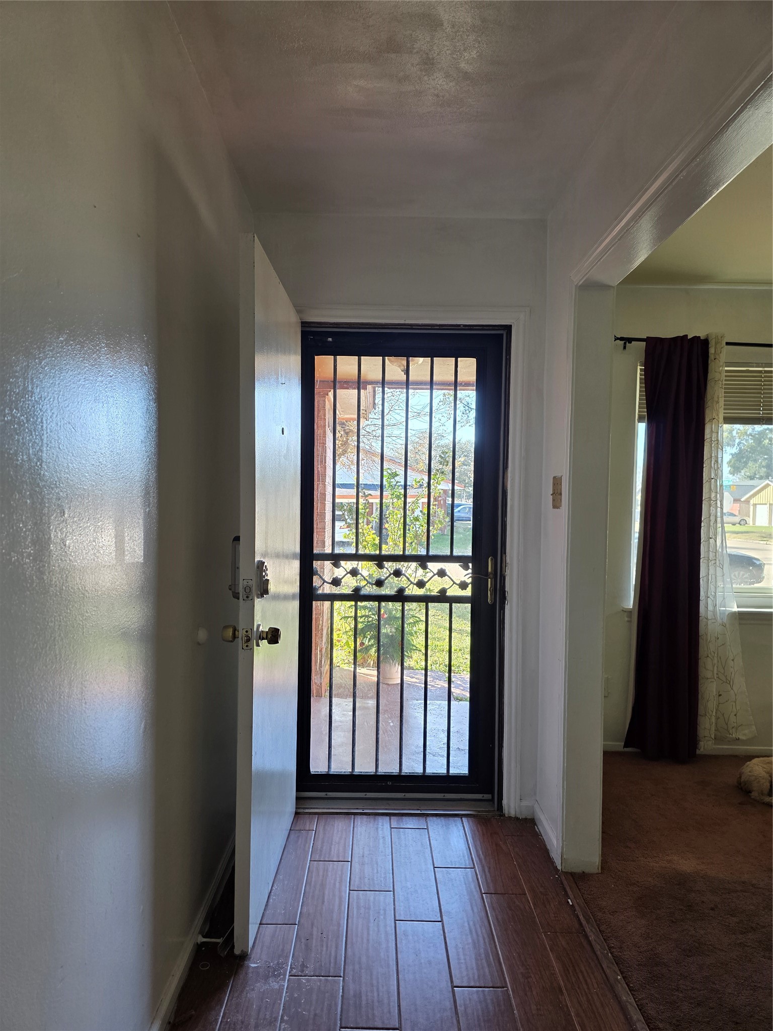 10403 White Clover Drive Houston, TX 77089 - Photo 2 of 11 an empty room with wooden floor and windows