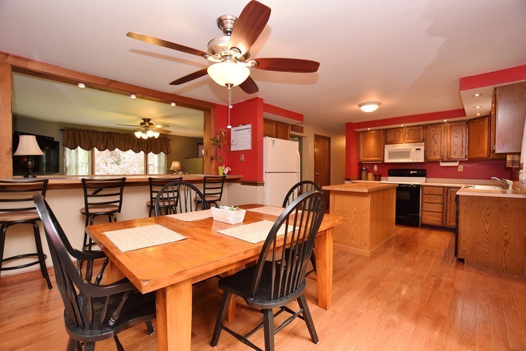 211 Bumstead Road Monson, MA 01057 - Photo 3 of 30 a view of a dining room with furniture and a kitchen