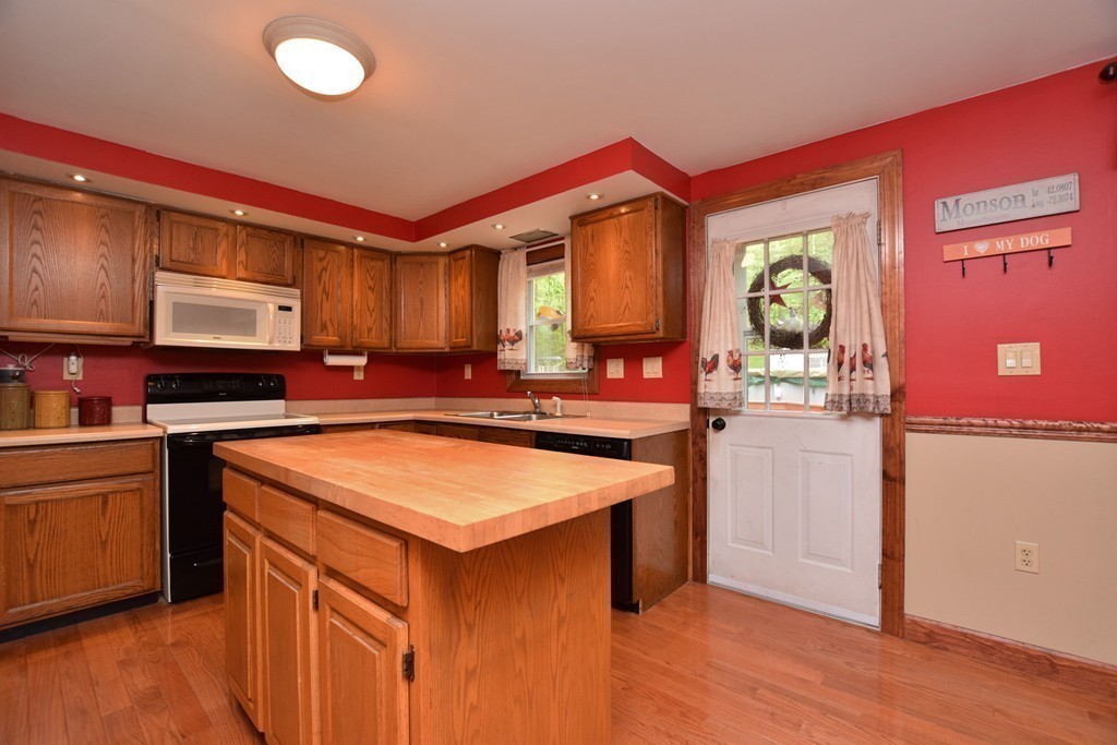 211 Bumstead Road Monson, MA 01057 - Photo 5 of 30 a kitchen that has a sink and a stove in it