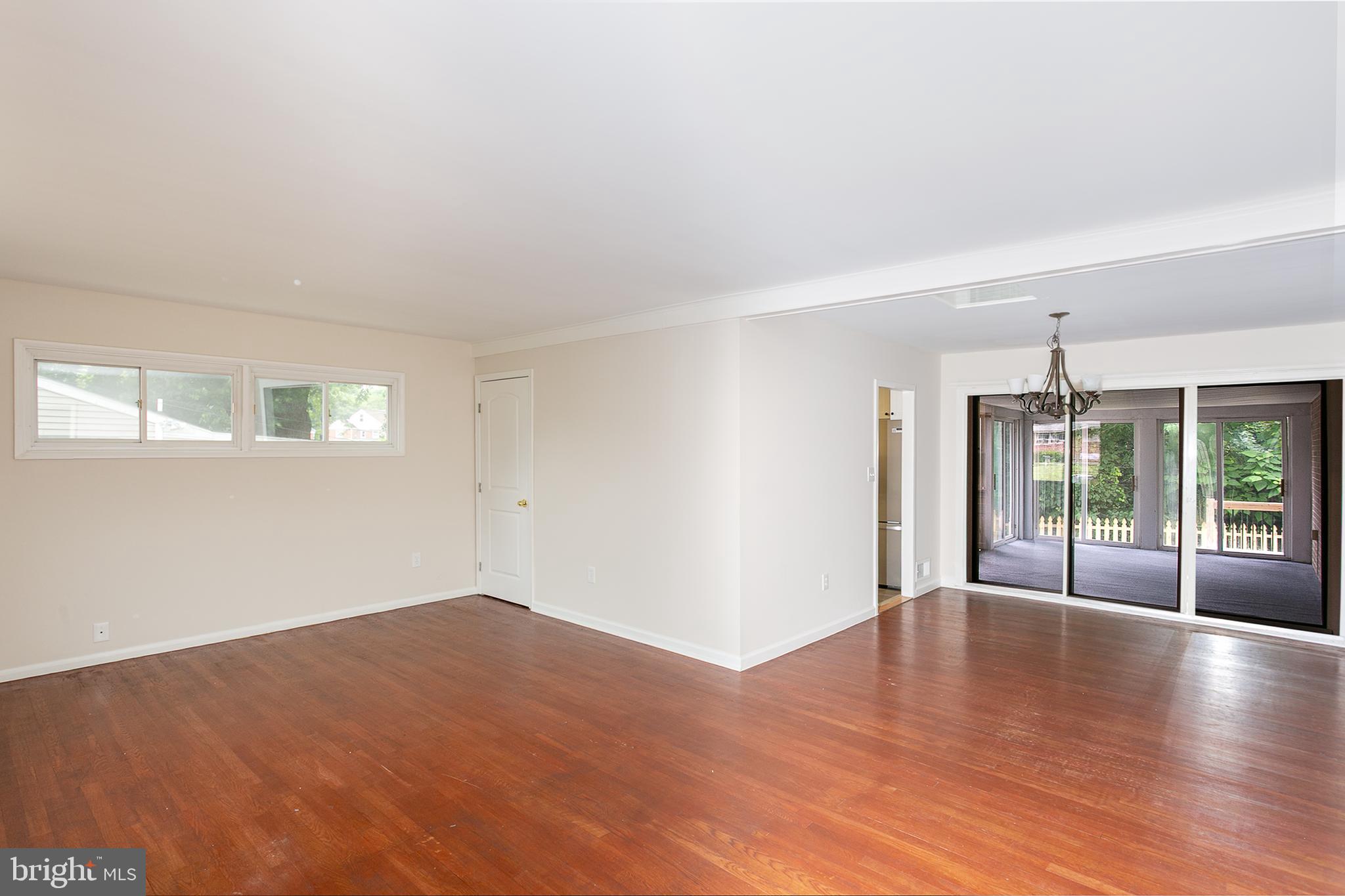 8703 Edgefield Road Baltimore, MD 21234 - Photo 7 of 30 living & dining rm & sliders to back porch,