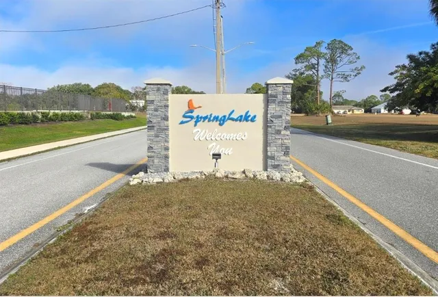 a view of a street with a building in the background