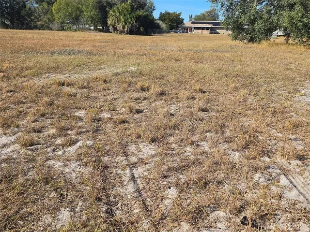 a view of a field with an outdoor space