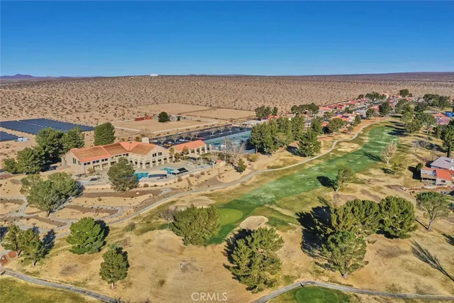 an aerial view of a building with beach
