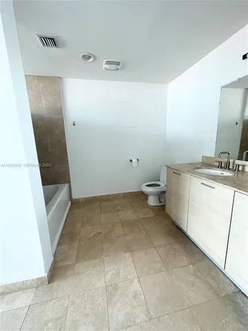 a view of a storage & utility room with a sink