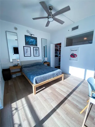 a living room with hard wood floor and furniture