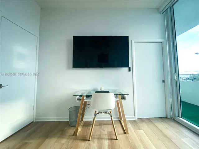 a view of a livingroom with furniture and wooden floor