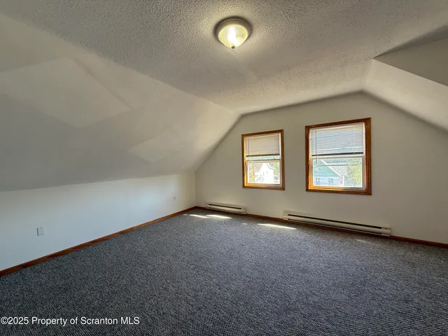 an empty room with a empty space and window