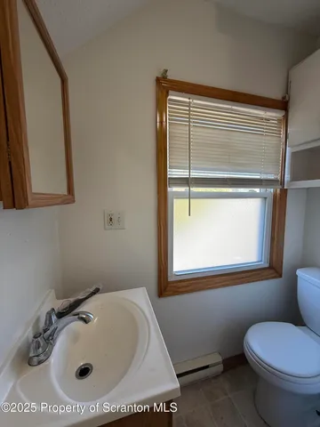 a bathroom with a sink and a toilet