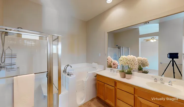 a view of a dining room with furniture and a chandelier