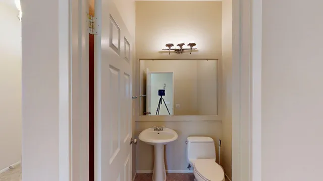 a view of kitchen with stainless steel appliances granite countertop a refrigerator and a sink