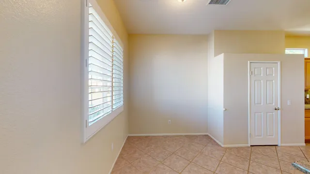 a kitchen with granite countertop a stove and cabinets