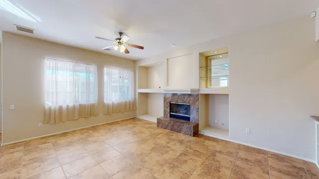 a view of kitchen with refrigerator stove and furniture
