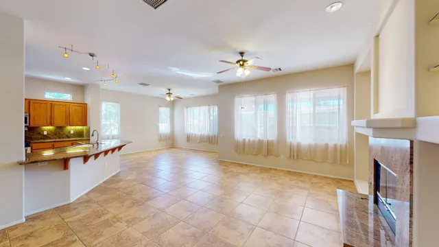 a view of an empty room with a fireplace