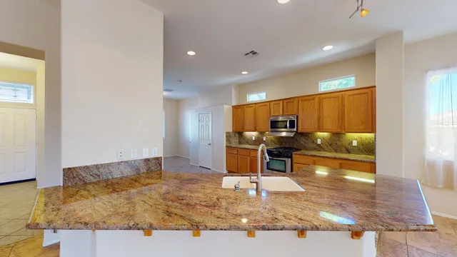a bathroom with a glass shower door and a glass door