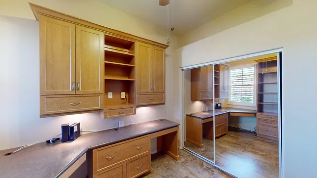 a view of a room with wooden walls